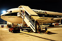 /images/133/1998-12-italy-milano-airport.jpg - #00210: red car by people getting off Alitalia airplane at Milano airport … Dec 1998 -- Milano, Italy