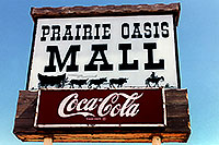 /images/133/1999-04-south-dakota-sign.jpg - #00320: Prairie Oasis Mall - Cowboy and cows wagon picture - Coca Cola sign … Christina moving Chicago-Phoenix … April 1999 -- Faith, South Dakota