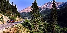 /images/133/2002-06-independence-road1-pano.jpg - #00944: red Jeep Grand Cherokee heading to Aspen from Independence Pass … June 2002 -- Independence Pass, Colorado