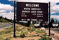 /images/133/2004-06-mtevans-highest-road.jpg - #01545: `Welcome - North Americas Highest Auto Road - elev 14,260 ft (4,346.5 meters) - 14 miles (22.5km)`(br)start of Mt Evans road, highest road in North America … June 2004 -- Mount Evans Road, Mt Evans, Colorado