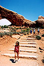 /images/133/2004-07-arches-girl-walking-v.jpg - #01601: girl walking in Arches National Park … Aneta, Ola and Ewka in background … July 2004 -- Arches Park, Utah