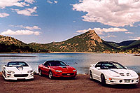 /images/133/2004-07-estes-transams1.jpg - #01650: white and red Pontiac TransAm cars at Estes Lake … July 2004 -- Estes Park, Colorado