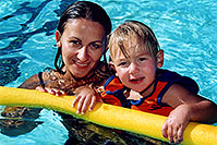 /images/133/2004-08-pool-ola-float.jpg - #01962: Ola and Cooper in the pool … August 2004 -- Greenwood Village, Colorado