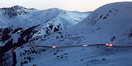 /images/133/2006-02-loveland-night-first-w.jpg - #02757: cars moving along the road up to Loveland Pass from Keystone side … Feb 2006 -- Loveland Pass, Colorado