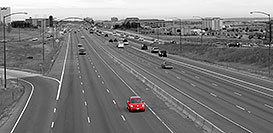/images/133/2006-10-06-lone-red-bug-bw.jpg - 02938: red VW Beetle Bug heading south on I-25 in Lone Tree … Oct 2006 -- I-25, Lone Tree, Colorado