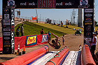 /images/133/2009-10-11-pbr-off-tri-bike-115882.jpg - #07559: 02:54:23 Finisher on a water slide - PBR Offroad Triathlon, Oct 11, 2009 at Tempe Town Lake … October 2009 -- Tempe Town Lake, Tempe, Arizona