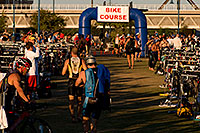 /images/133/2009-10-25-soma-transition-118202.jpg - #07729: 00:50:08 Swimmers transitions to bikes at Soma Triathlon … October 25, 2009 -- Tempe Town Lake, Tempe, Arizona