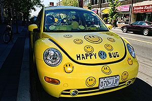 Happy yellow VW Beetle Bug in Toronto