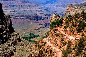 view of Bright Angel Trail, with green-roofed water-stop â€¦ trail leading to Plateau point