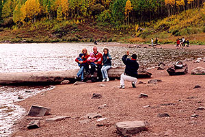 People at Maroon Lake with Maroon Peaks in the background