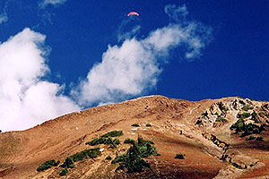 Orange Paraglider over Cinnamon Mountain (12,293ft)