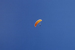 Orange Paraglider over Cinnamon Mountain (12,293ft)