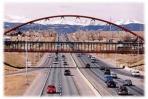 red VW Beetle Bug heading east to Denver along I-36 … view west towards Boulder