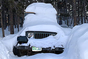 snowy green Jeep Wrangler
