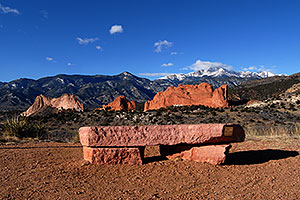 view of Garden of the Gods with Pikes Peak in the clouds