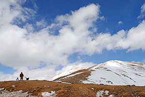 hikers returning down the east face of Loveland Pass