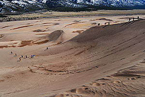 people walking down Great Sand Dunes