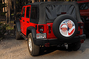 Santa`s 2007 red Jeep Wrangler - Santa with white beard on board