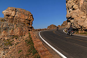 Motorcycles (riding west) at Rock Cut (12,145 ft) along Trail Ridge Road