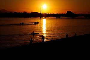 Fishermen and Scullers at sunset at Tempe Town Lake