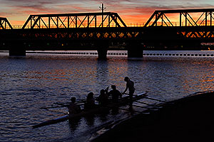 Scullers at sunset on North Bank Boat Beach at Tempe Town Lake