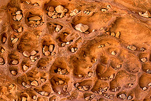 Rocks within the vertical cracks of a boulder along Havasupai Trail