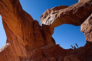 People at Double Arch in Arches National Park