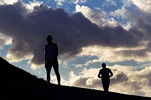 09:30:53 - Runner silhouettes as the sun goes down, after 9 hours of swim/bike/run - Ironman Arizona 2010