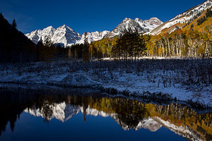 Snowy Pond reflection of Maroon Bells, Colorado