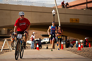 06:45:04 - #34 Paul Amey [USA] (far right) in the lead (eventually 2nd) lapping #29 Douglas MacLean [USA] in Lap 2 - Ironman Arizona 2011