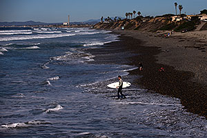 Surfers by Carlsbad, California
