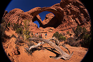 Hikers at Double Arch in Arches National Park