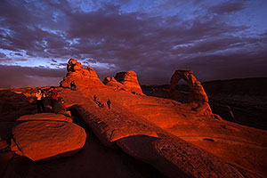 People at Delicate Arch in Arches National Park