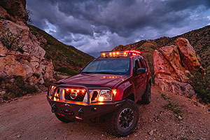 Monsoon clouds and Xterra in Box Canyon